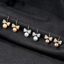 Load image into Gallery viewer, Sterling Silver Small Ribbon Natural Pearl Studs - Enumu