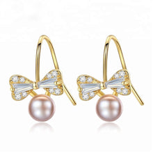 Load image into Gallery viewer, Sterling Silver Small Ribbon Natural Pearl Studs - Enumu