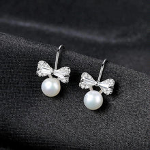 Load image into Gallery viewer, Sterling Silver Small Ribbon Natural Pearl Studs - Enumu