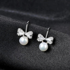 Sterling Silver Small Ribbon Natural Pearl Studs - Enumu