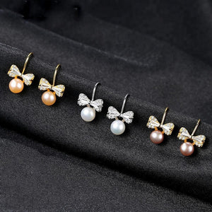 Sterling Silver Small Ribbon Natural Pearl Studs - Enumu